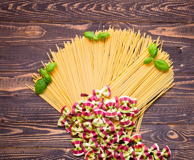 Close-up of decorating Italian pasta. On a wooden background