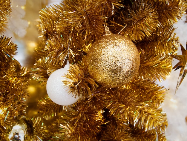 Close-up Decorative Golden Ball Hanging on Golden Tree