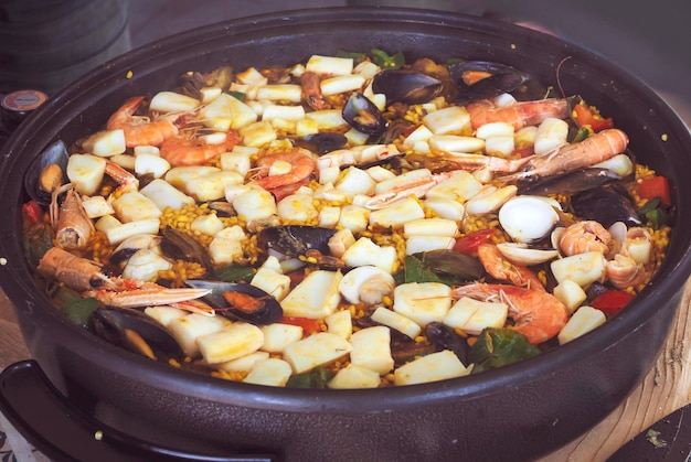 Close up to a delicious home made paella with seafoods