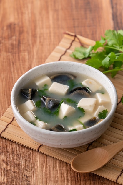 Close up of delicious tofu and century egg soup with coriander in Taiwan