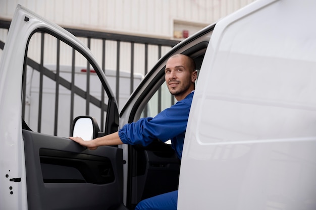 Close up delivery man in van