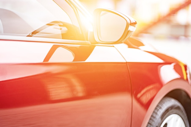 Close up detail on one of the red car taillight modern red crossover car Exterior detail business automobile