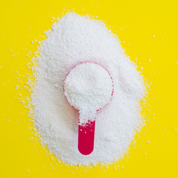 Close-up detergent powder with measuring cup