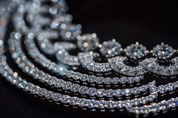 close up of a diamond necklace on a black background