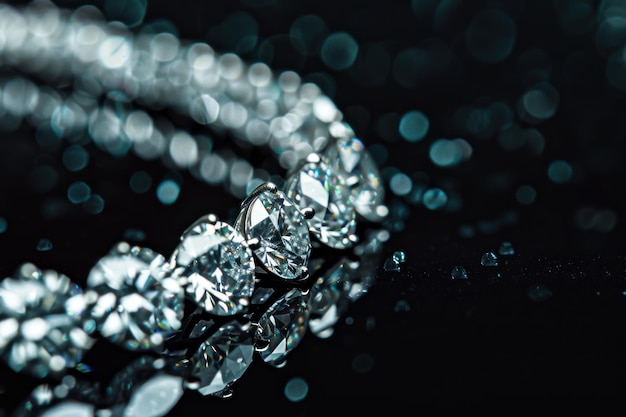 close up of a diamond necklace on a black background