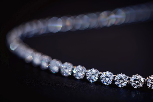 close up of a diamond necklace on a black background