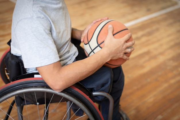 Close-up disabled man holding basketball