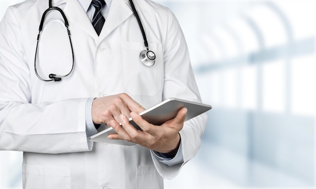 Close-up Doctor at hospital working with tablet pc