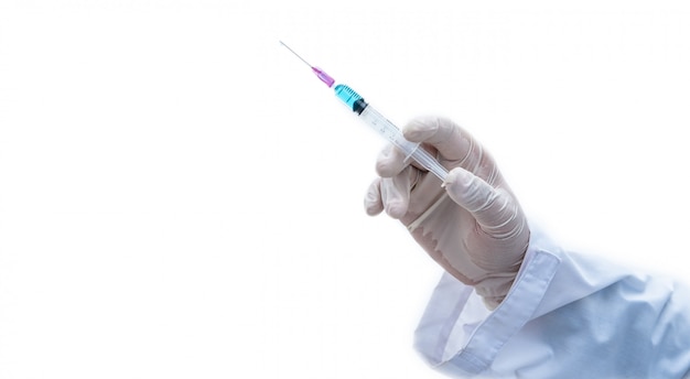 Close-up doctor with syringe ready for injection of vaccine to patient.