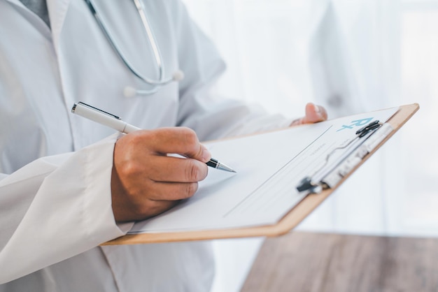 Close-up of doctors' hands jotting down something on the Medical Prescribtion. Medicine and healthcare concepts.