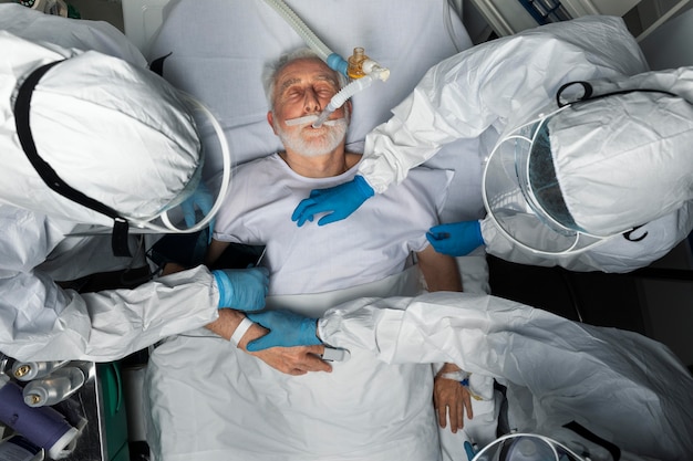 Close up doctors taking care of patient above view