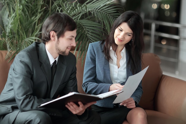 Close up employees of the company discussing financial documents