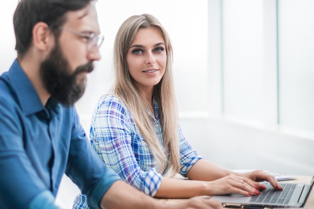 Close up. employees work together in a modern office