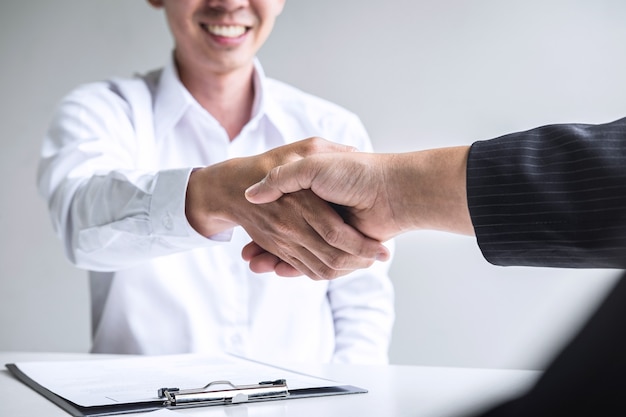 Close up of employer shaking hands with an employee