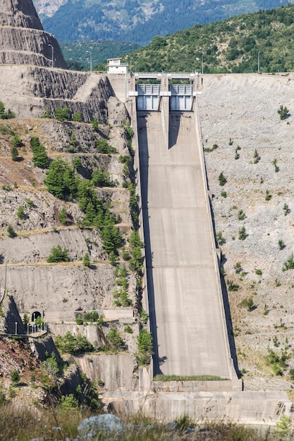 Close up on empty dam barrier in mountains