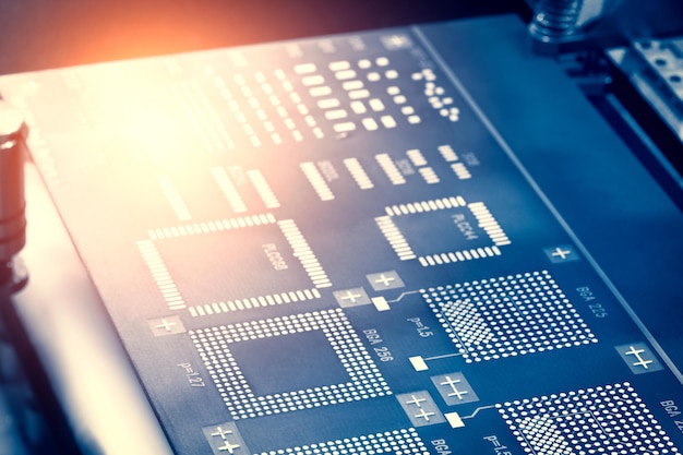 Close up of examining of test sample of microchip transistor under the microscope in laboratory Equipment for testing microchips Automation of production Manufacturing of microchips