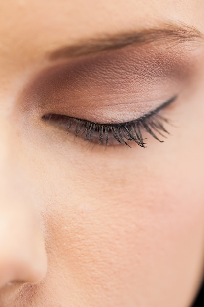 Close up on eye wearing eye liner and eye shadow