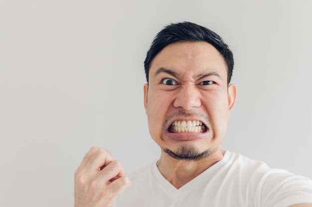 Close up face of angry man selfie himself.