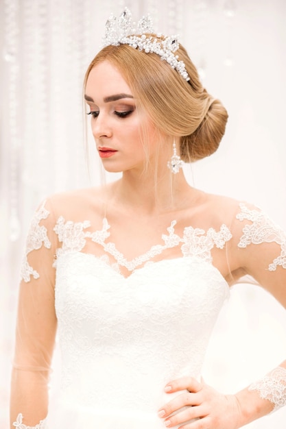 Close up of fashionable model in bridal dress