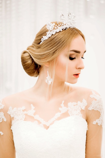 Close up of fashionable model in bridal dress