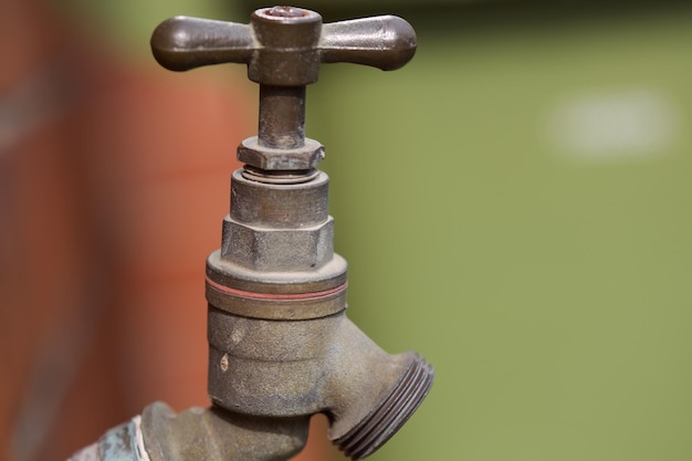 Close-up of faucet against wall