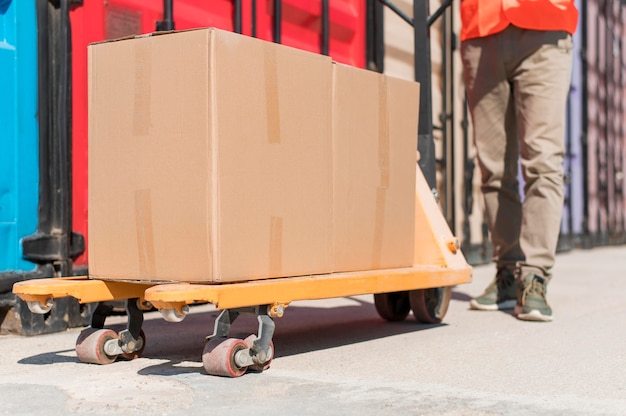 Close up feet near pallet truck