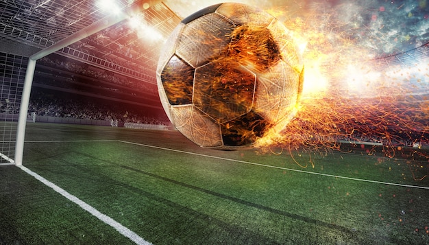 Close up of a fiery soccer ball kicked with power at the stadium scoring a goal