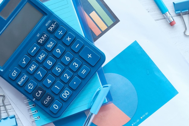 close up of financial diagram and calculator on table