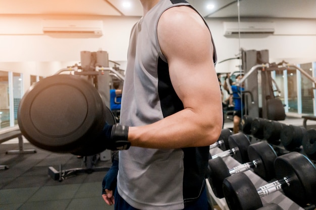 Close up fitness man exercise in the Gym