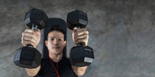 Close-up of fitness man, Handsome athletic guy workout with dumbbells,