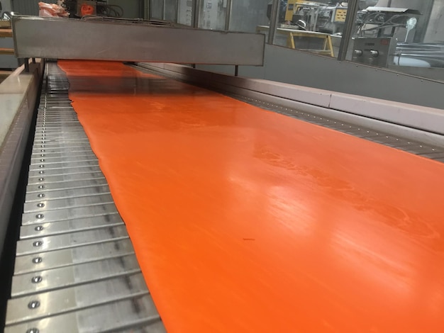 A close up of a floor with orange paint