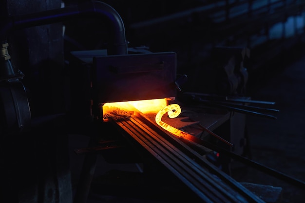 Close up of forge stove with pieces of steel heating inside