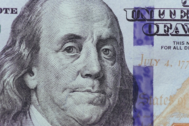 Close up of Franklin on one hundred dollars bill.