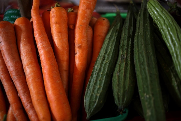 Close-up of fresh carrot, gambas and bitter gourd. Healthy fresh raw vegetables food.