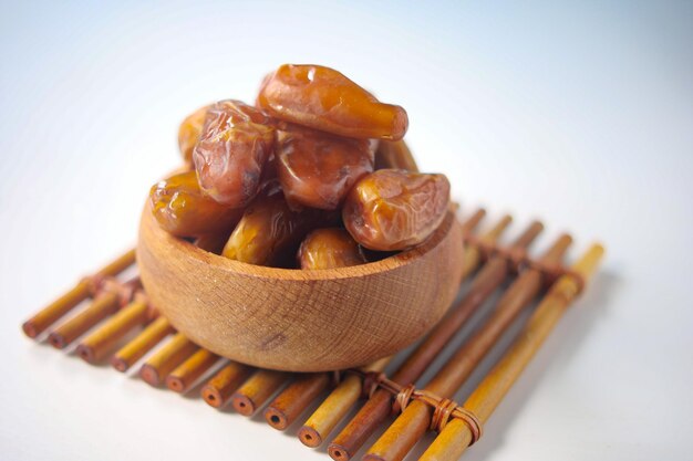 Close up of fresh date fruit in a bowl on table