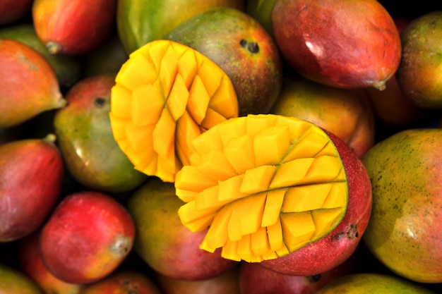 Close up fresh mango fruit on market stall in southern Spain