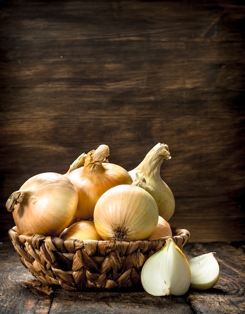 Close up on fresh onions in a basket