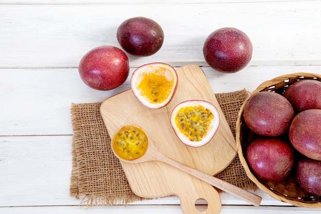 Close up a fresh passion fruit on white wooden table surface