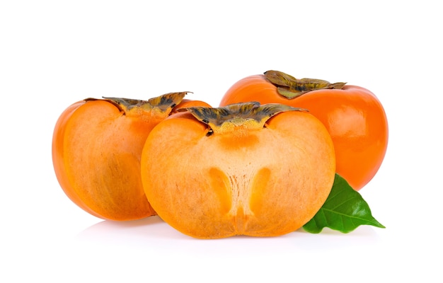 Close up fresh ripe persimmons with leaf