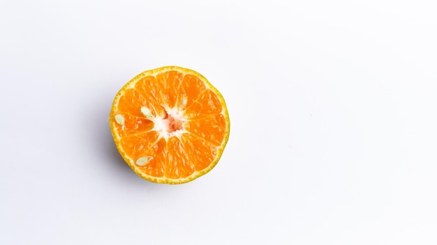 Close-up of freshly cut orange fruit isolated on white background