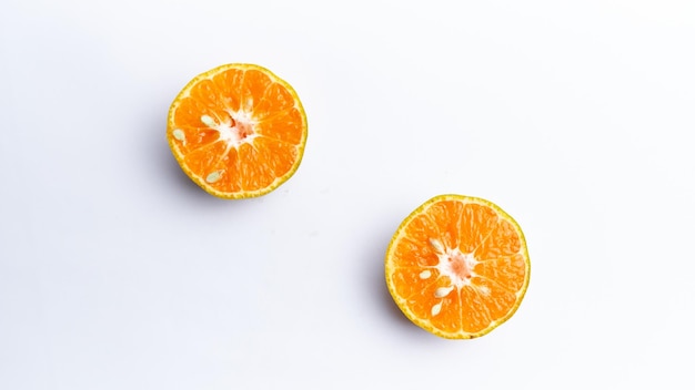 Close-up of freshly cut orange fruit isolated on white background