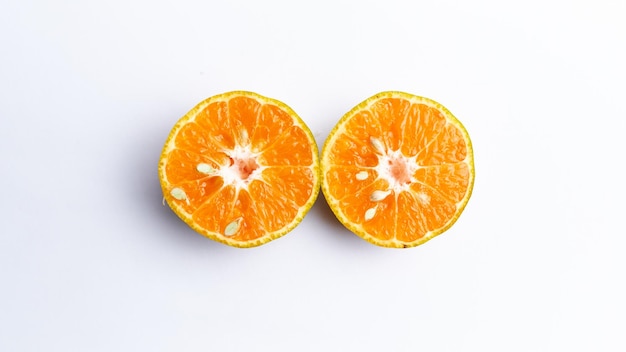 Close-up of freshly cut orange fruit isolated on white background