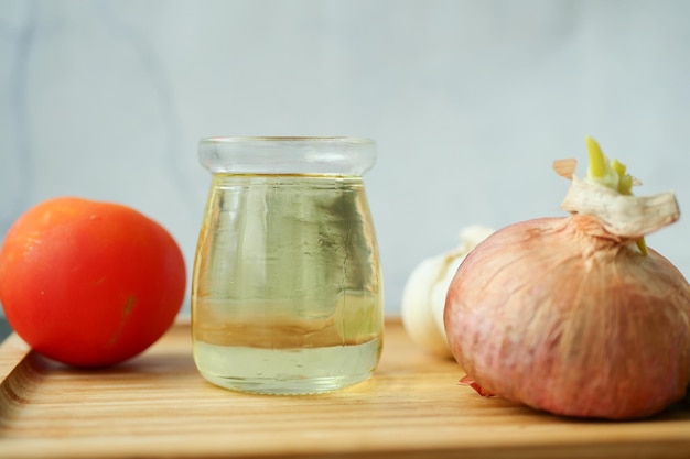 Close up of garlic tomato and olive oil on table