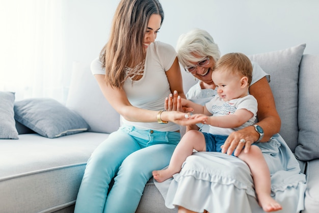 Close up of a generational family together in their living room at home, relaxing with the