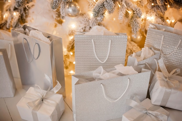 Close up on gift bags under Christmas tree