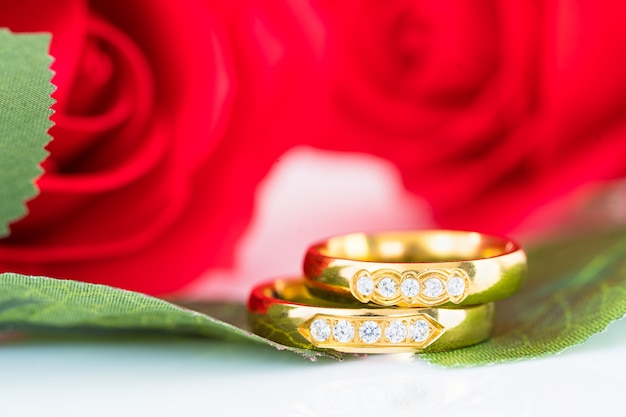 Close up Gold ring and Red roses