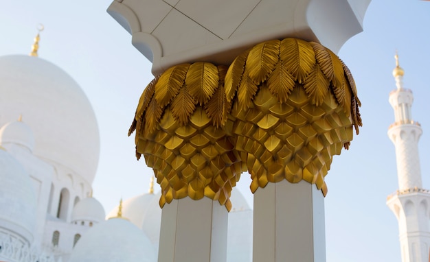 Close up golden decoration of columns in Grand white mosque in Abu Dhabi