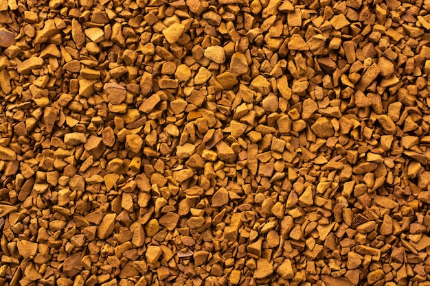 Close up on granules of instant coffee background