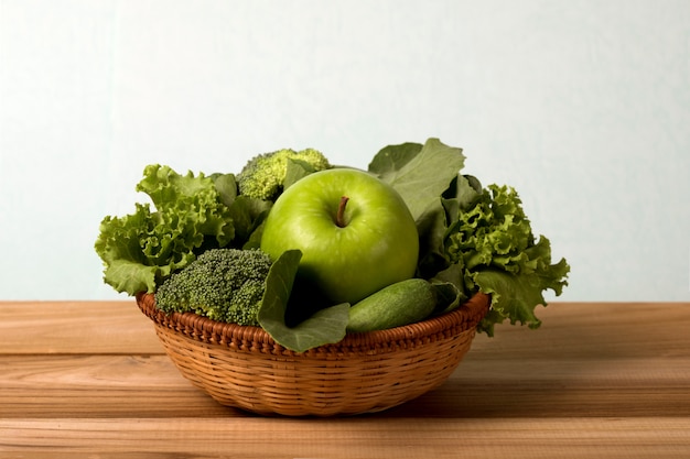 Close up green apple with mixed green vegetable  for healthy organic green food .