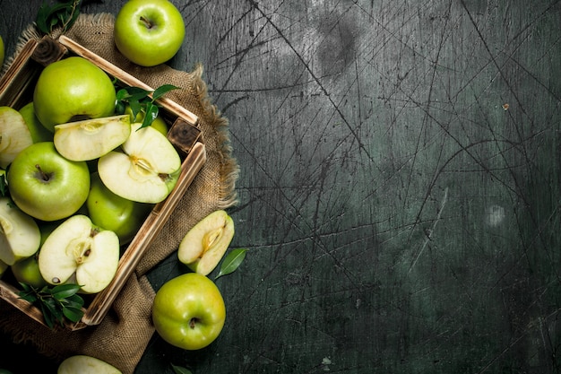 Close up on green apples in an old box